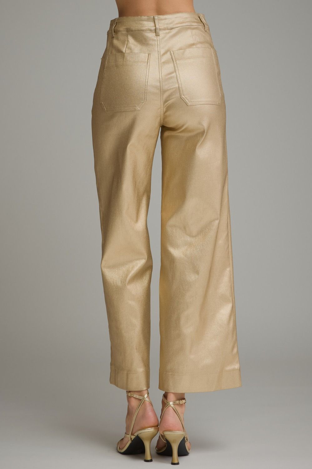 Back view of gold metallic wide leg pants with back pockets