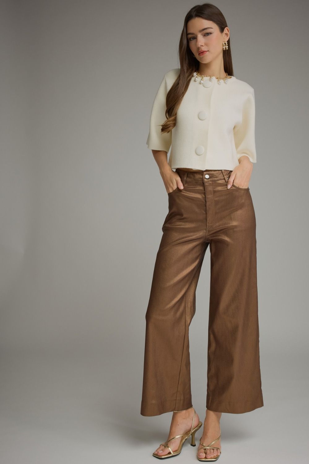 Full-length view of metallic brown wide leg pants styled with a white top