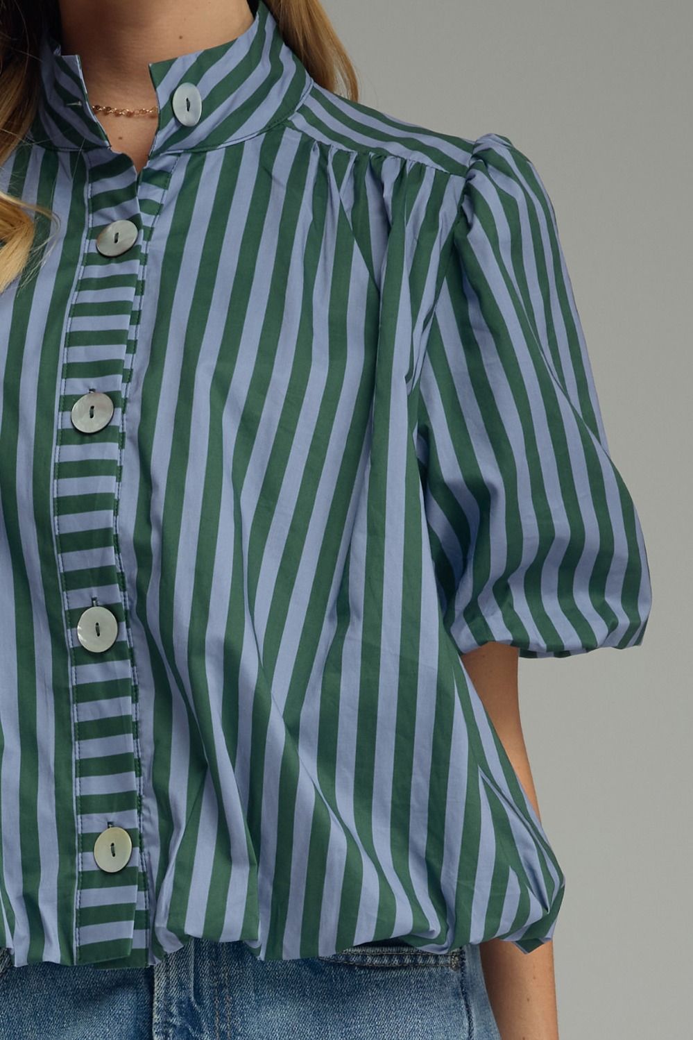 Close-up of hunter green stripe band collar and button front