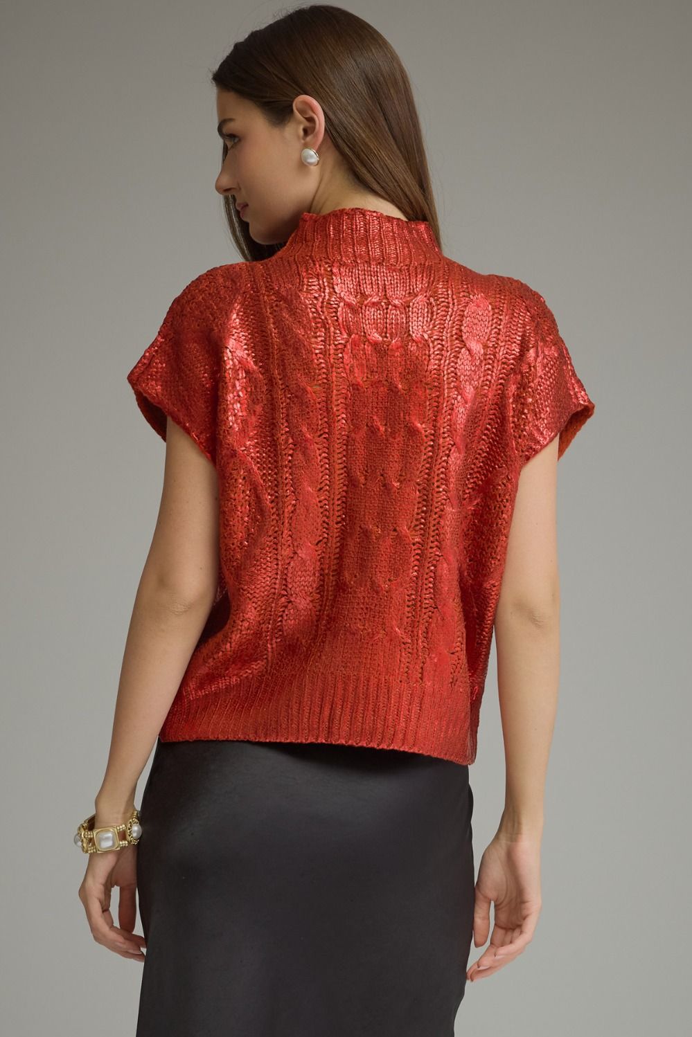 Back view of metallic red cable knit cap sleeve sweater top