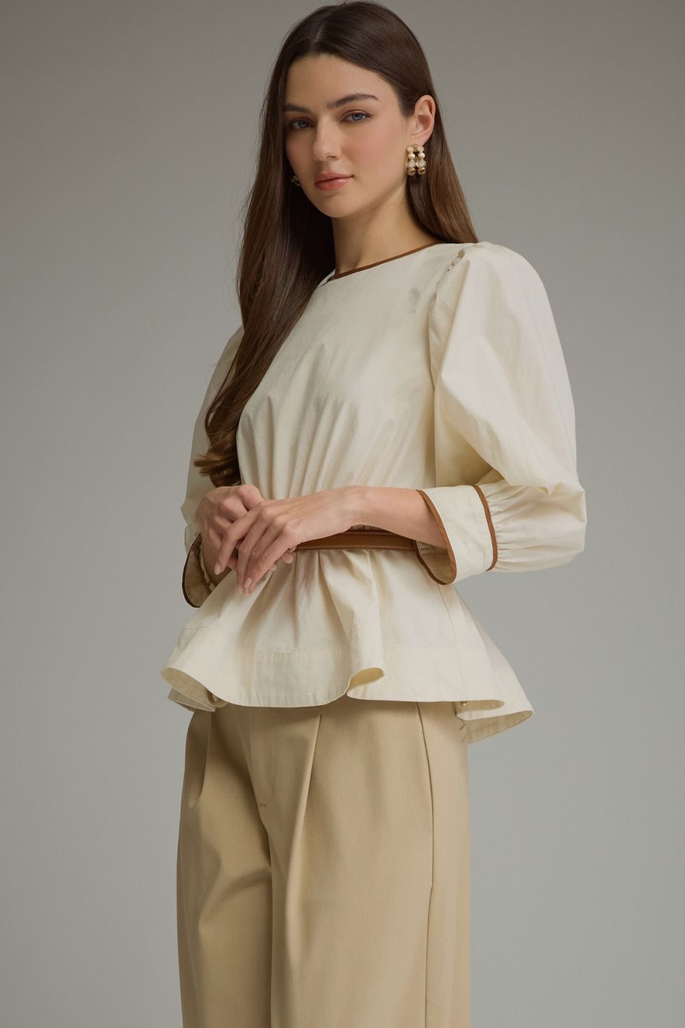 Ecru puff sleeve belted top with contrast trim, front view