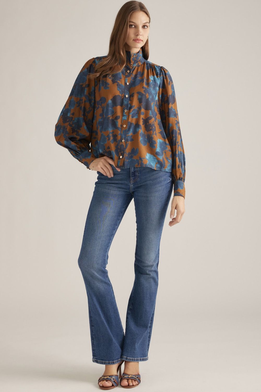 Full-length view of camel floral stand collar blouse styled with jeans