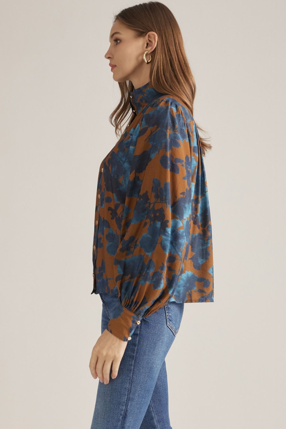 Side view of camel floral puff sleeve blouse