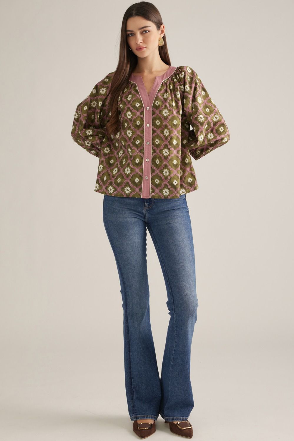 Full-length view of olive geo floral puff sleeve top styled with flare jeans
