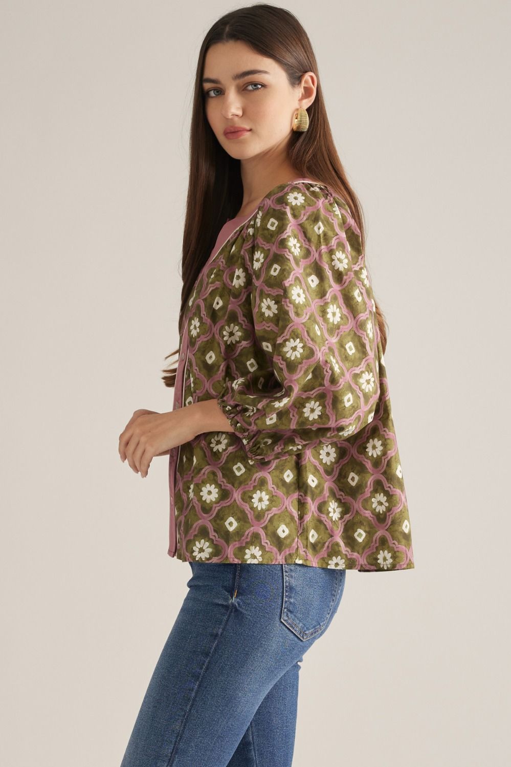 Side view of olive geo floral puff sleeve top