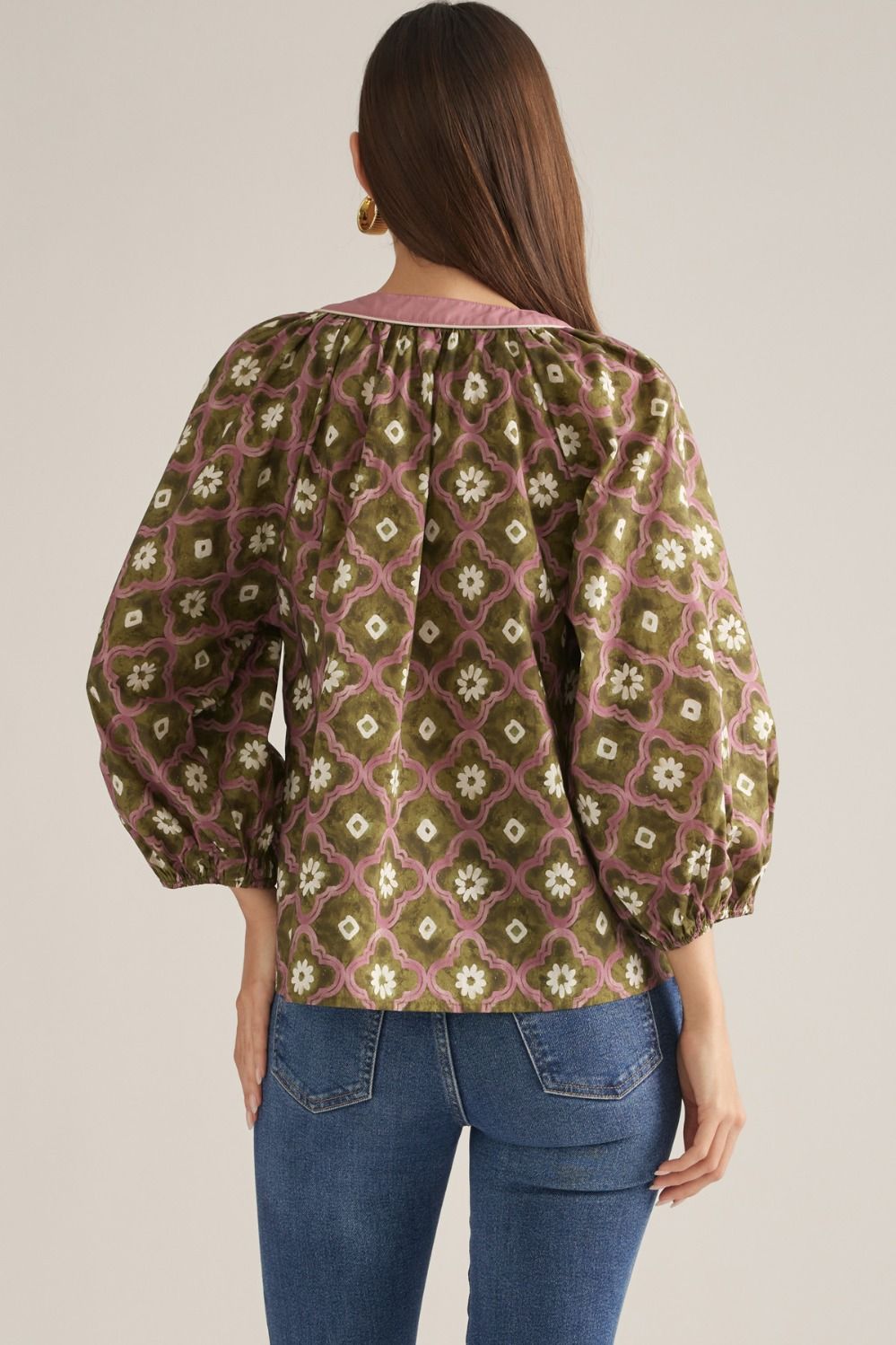 Back view of olive geo floral puff sleeve top