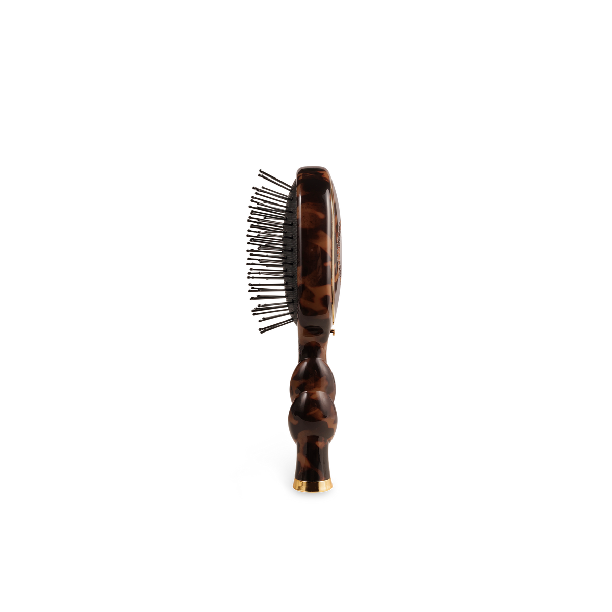 Side view of the tortoise mini detangler brush and its coil handle