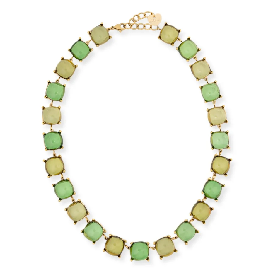 A gold-tone link necklace featuring alternating light green and pale yellow-green square cabochon gemstones, displayed on a clean white background.