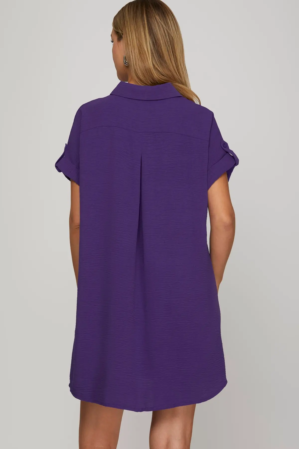 Back of a women wearing a purple dress