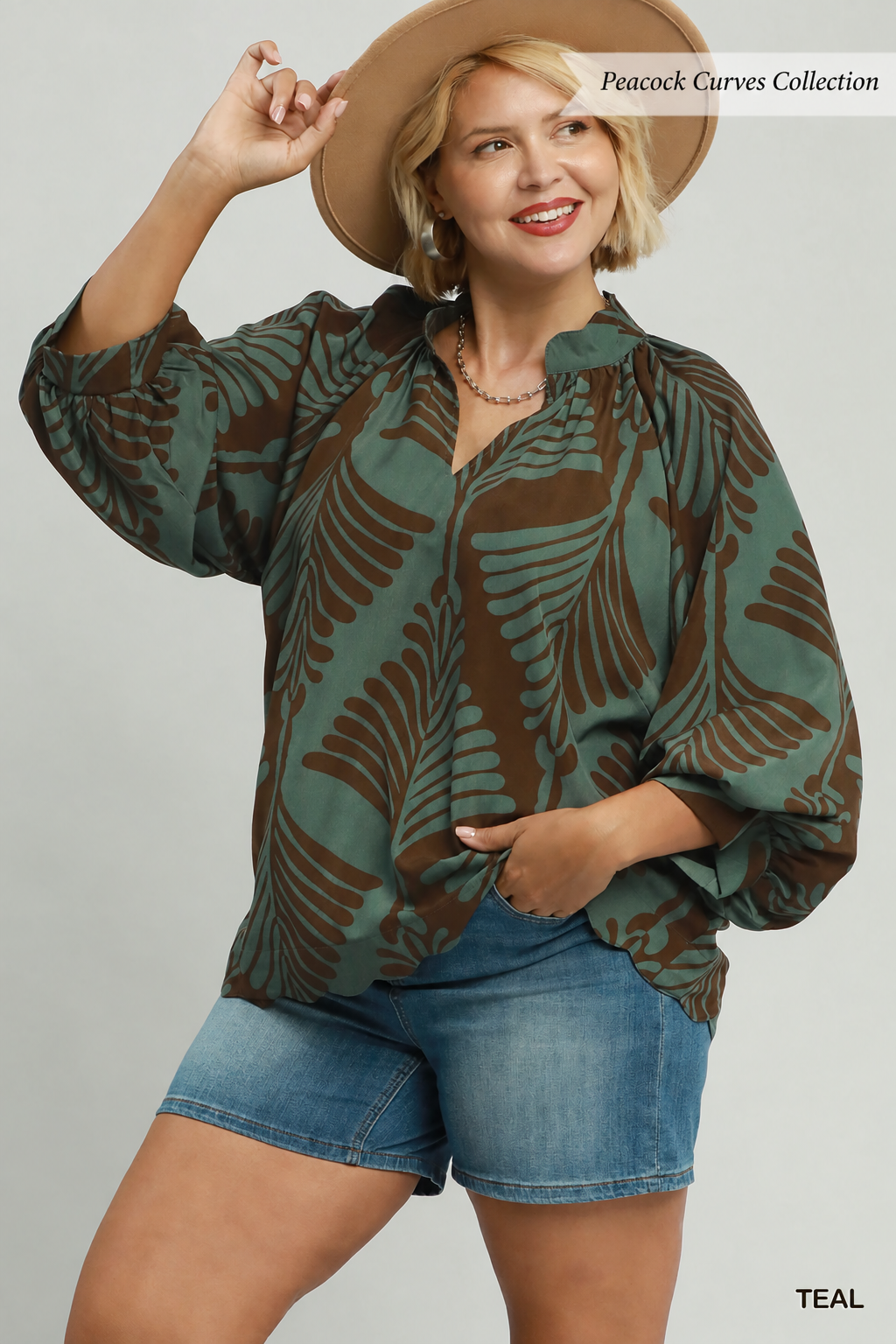 Teal print blouse with a brown abstract leaf print balloon long sleeves v neck
