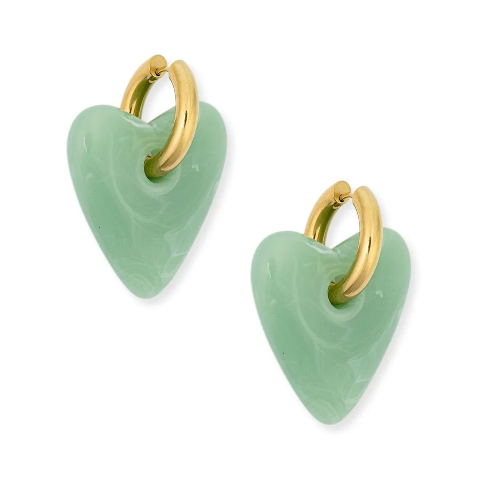 A pair of gold hoop earrings with light green heart-shaped stone pendants, shown on a clean white background.