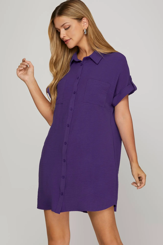 a women wearing a Purple woven button down dress with drop shoulders