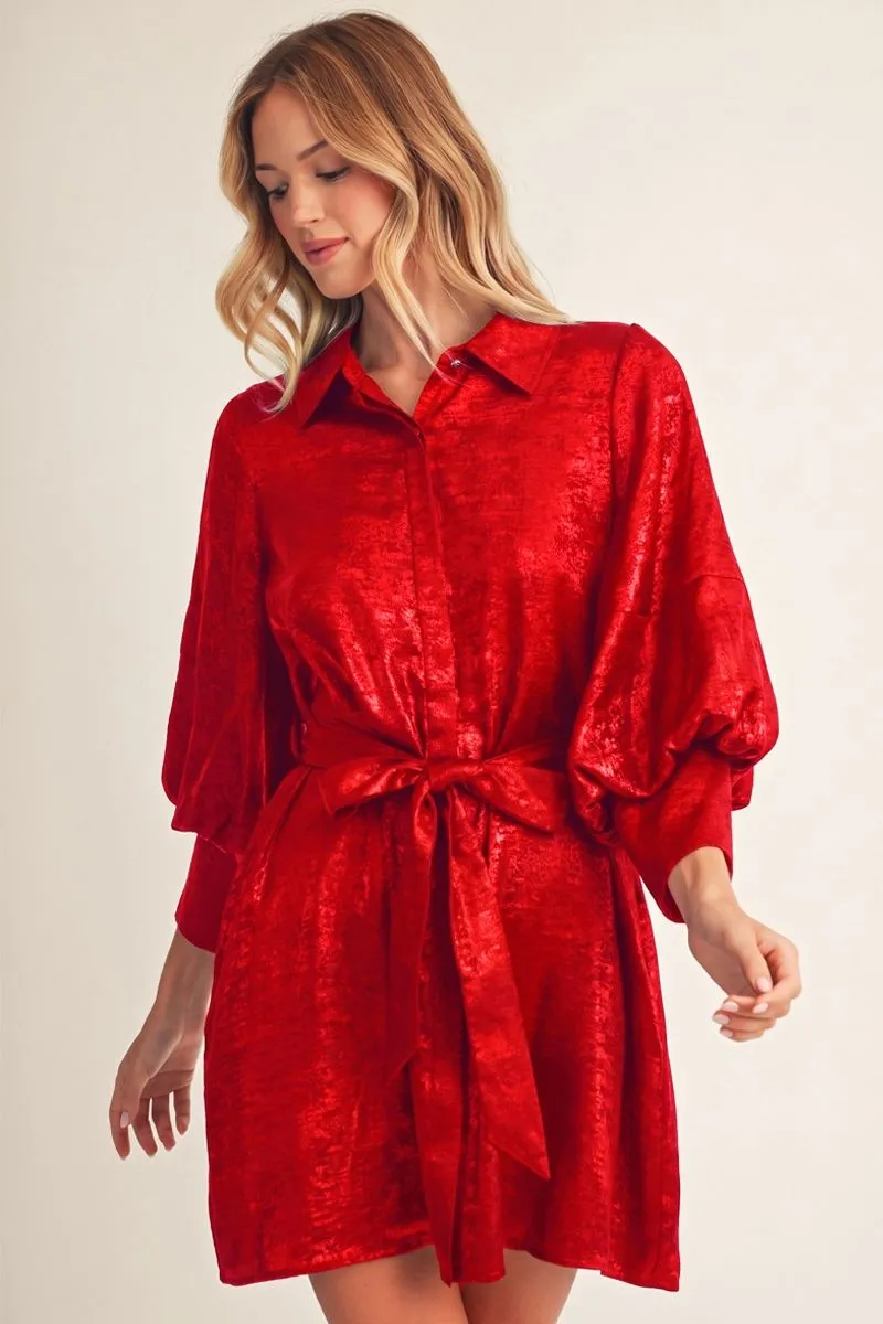 Red metallic button-down shirt dress with bishop sleeves and a tied waist, front view