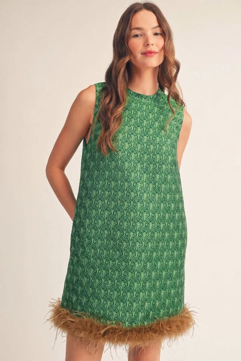 Emerald green jacquard sleeveless shift dress with a caramel feather-trim hem, front view