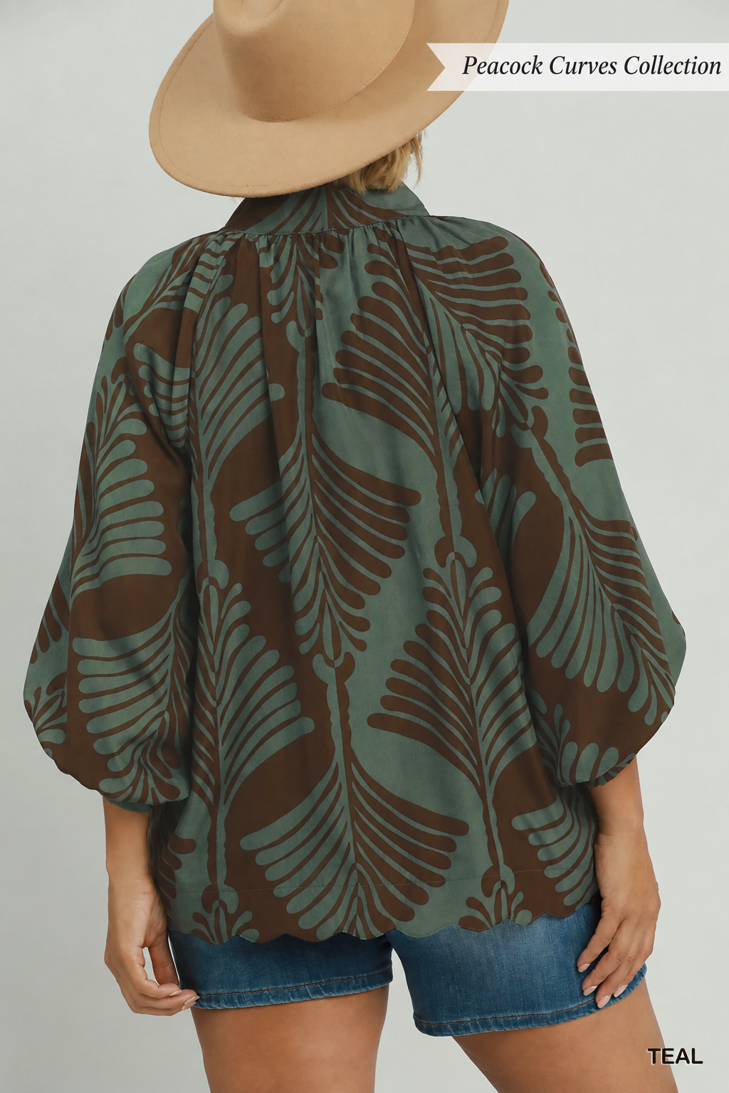 Teal print blouse with a brown abstract leaf print balloon long sleeves v neck