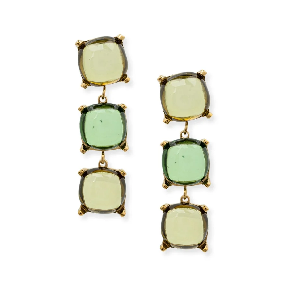 A pair of gold drop earrings featuring three stacked, cushion-cut green gemstones in gold prong settings, shown against a plain white background.