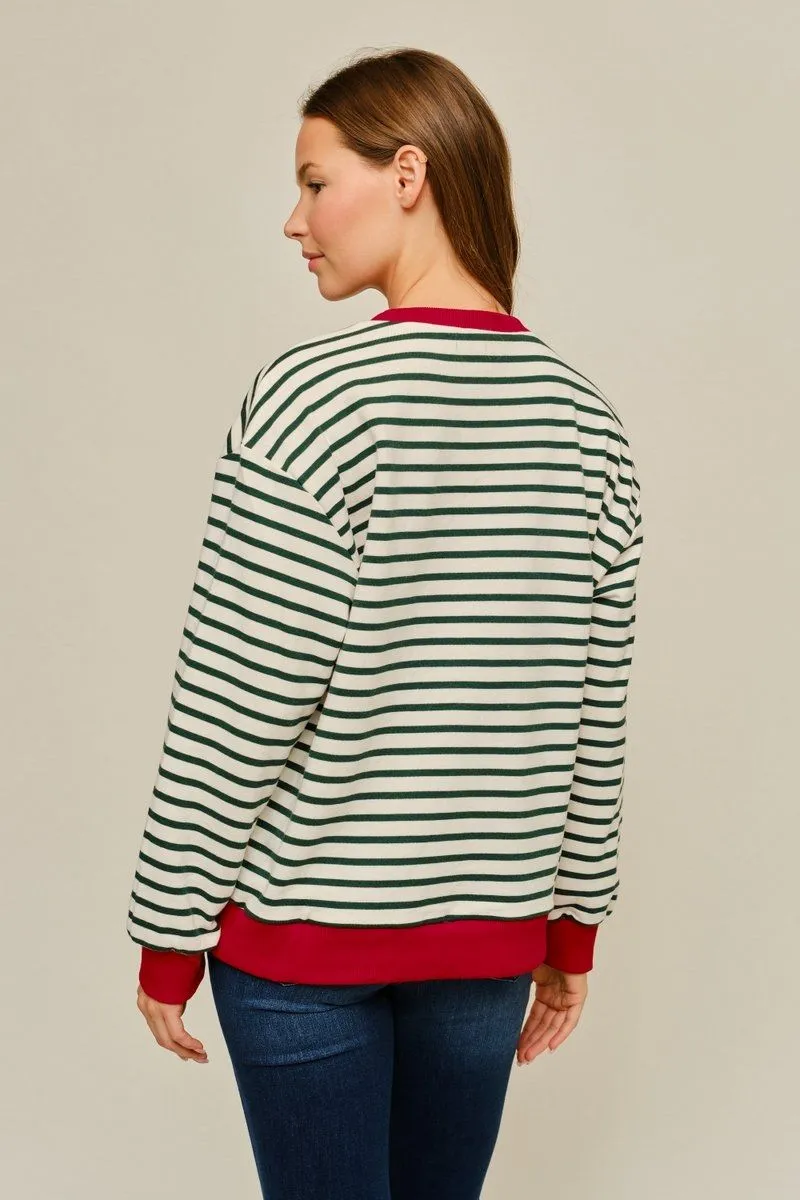 Back view of the cream and green striped pullover