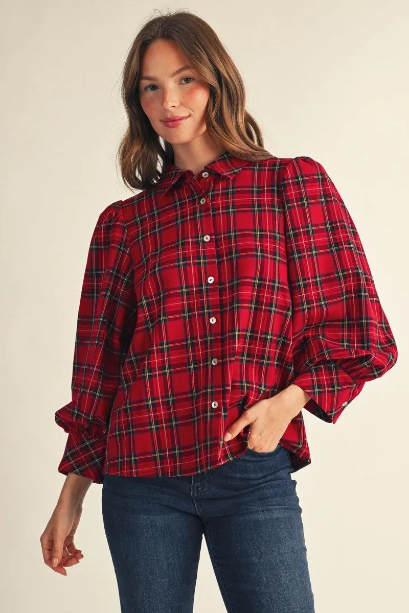 Plaid Tidings Top shown at an angle with hands in jean pockets