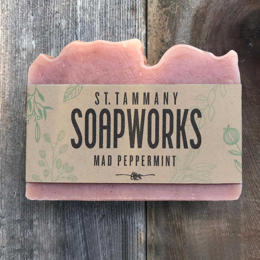 Mad Peppermint Soap bar by St. Tammany Soapworks in kraft label wrap on rustic wood