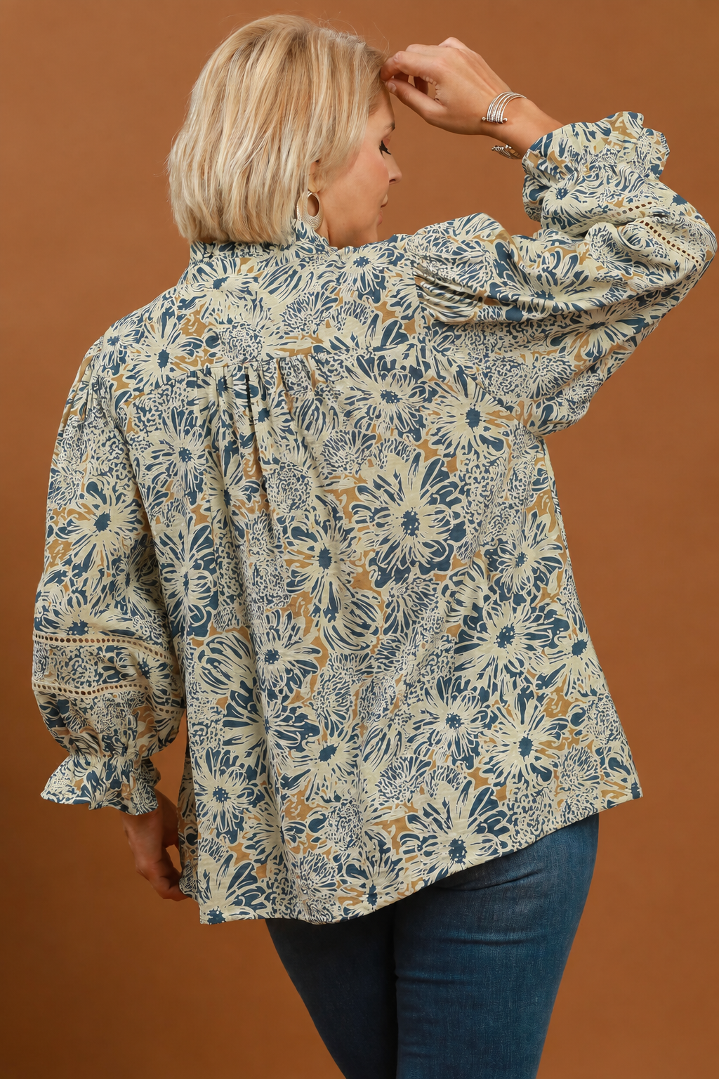 Model wearing a floral print lace trim blouse